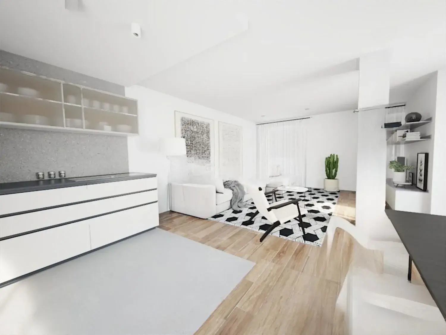 Salón y cocina abierta de un apartamento reformado en Comarruga